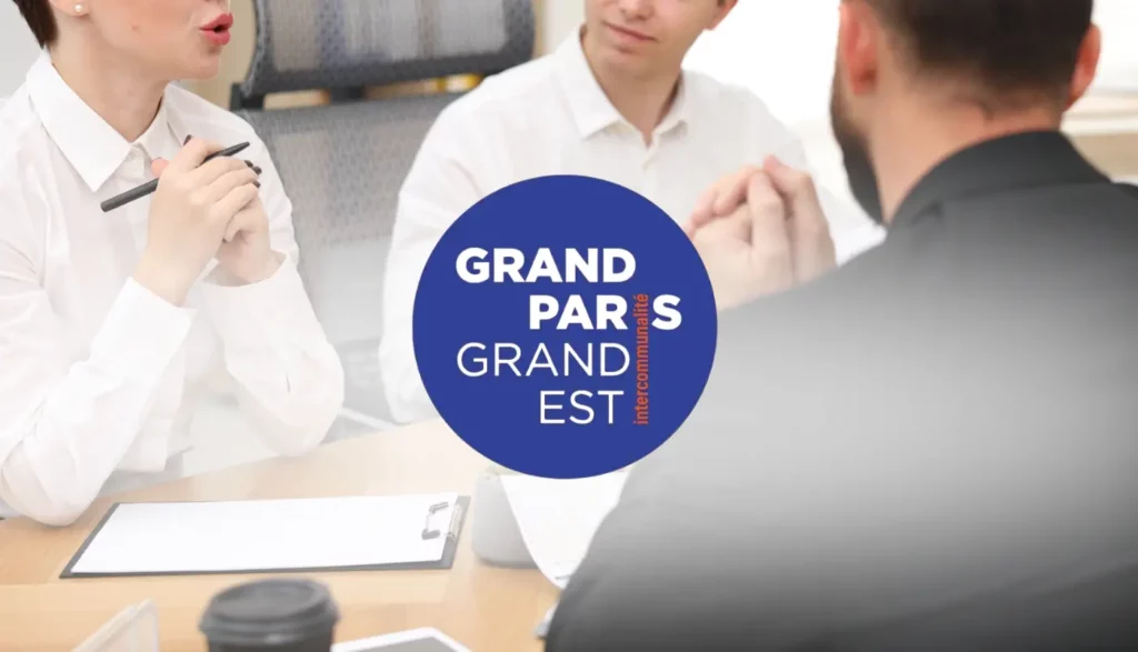 personnes qui travaillent avec le logo Grand paris grand est